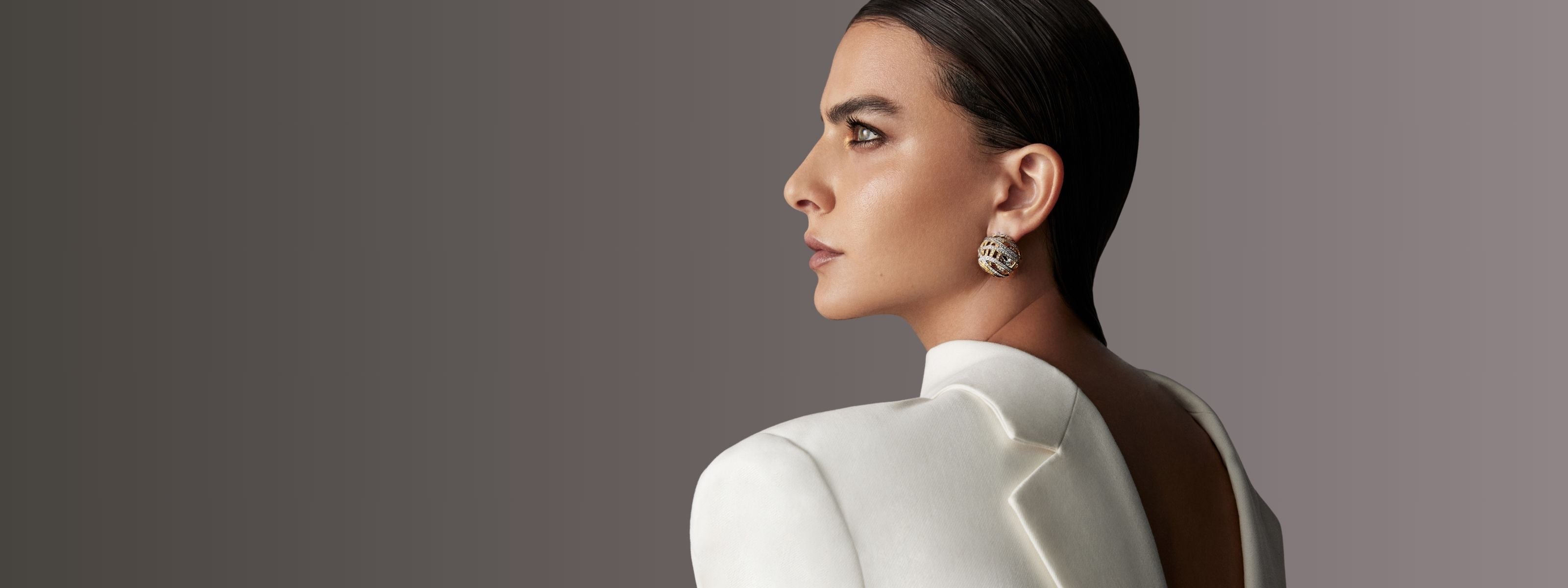 Model wearing handcrafted jewelry in gold and diamonds