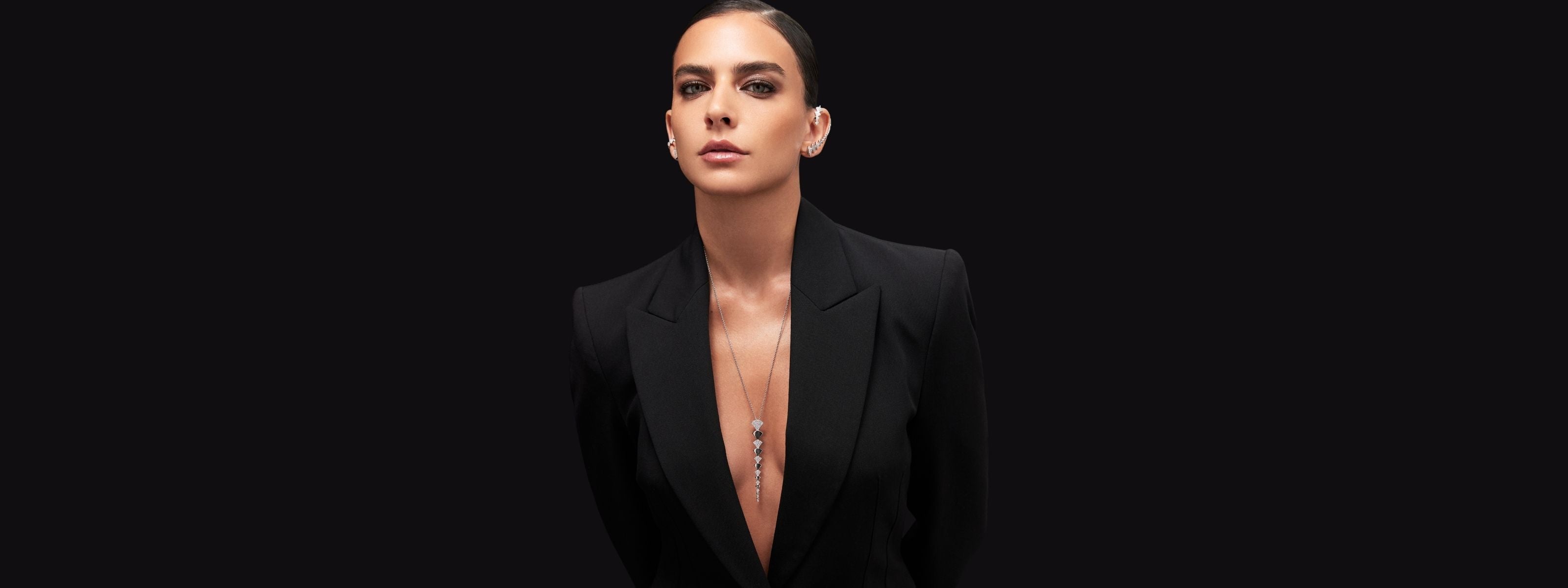 Model wearing handcrafted jewelry in gold and diamonds