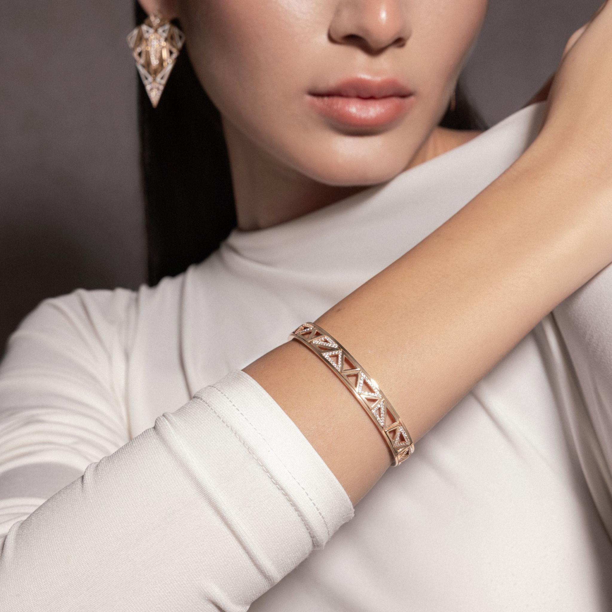 Model wearing Handcrafted Trilliance Bangle-high jewelry in gold and diamonds
