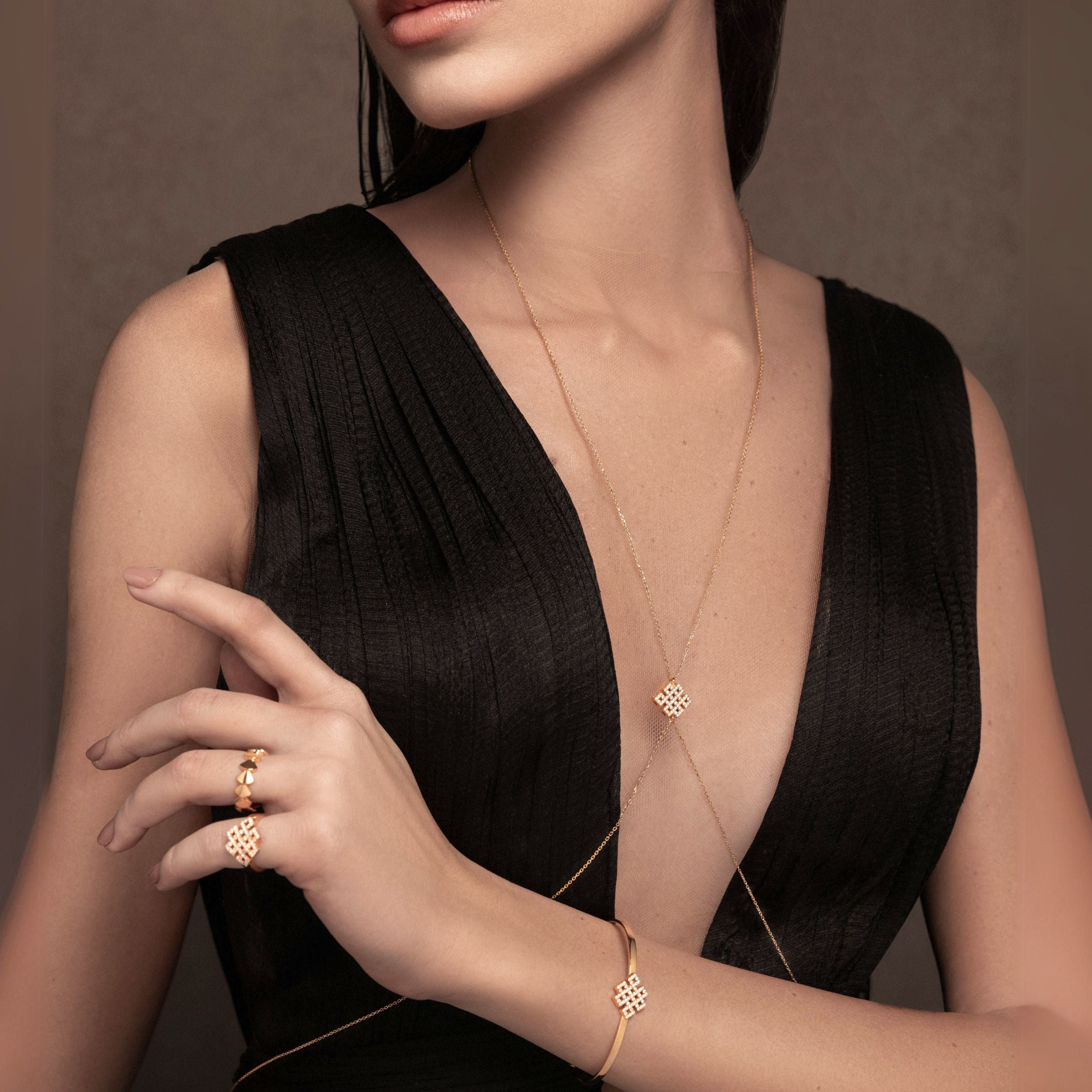 Model wearing Power Knot -handcrafted jewelry in gold and diamonds-Josette Leon