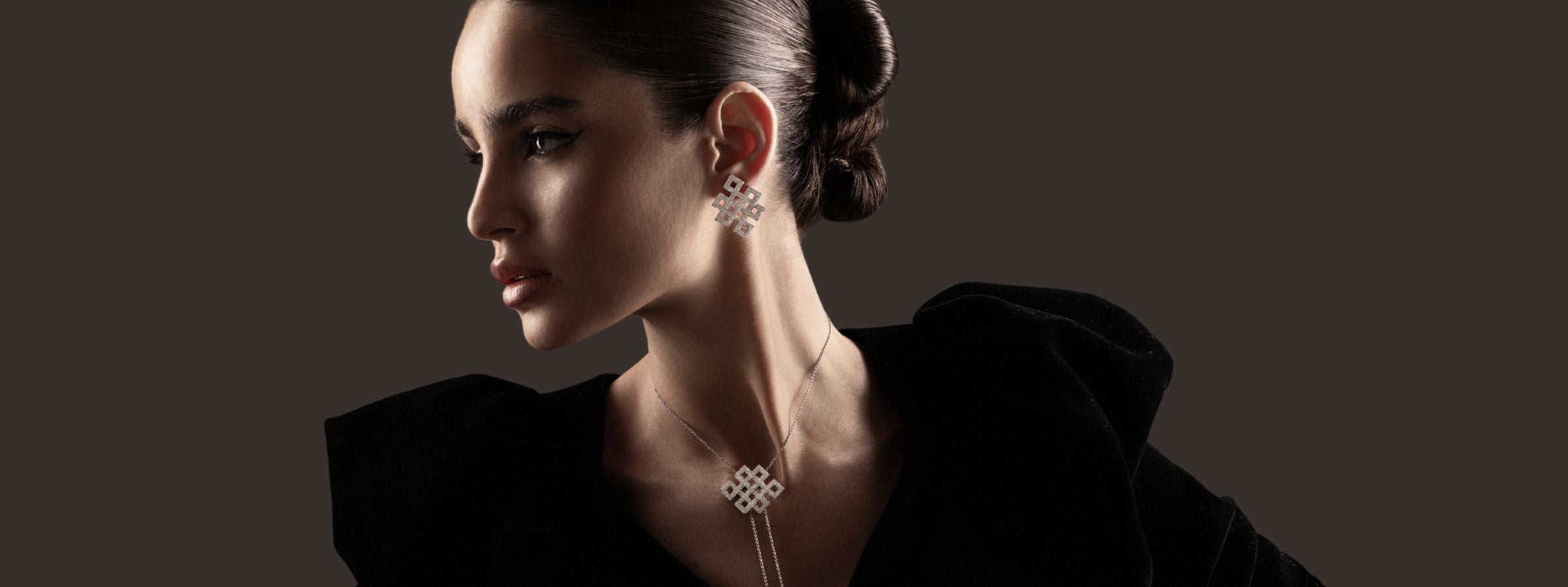 Model wearing handcrafted jewelry in gold and diamonds