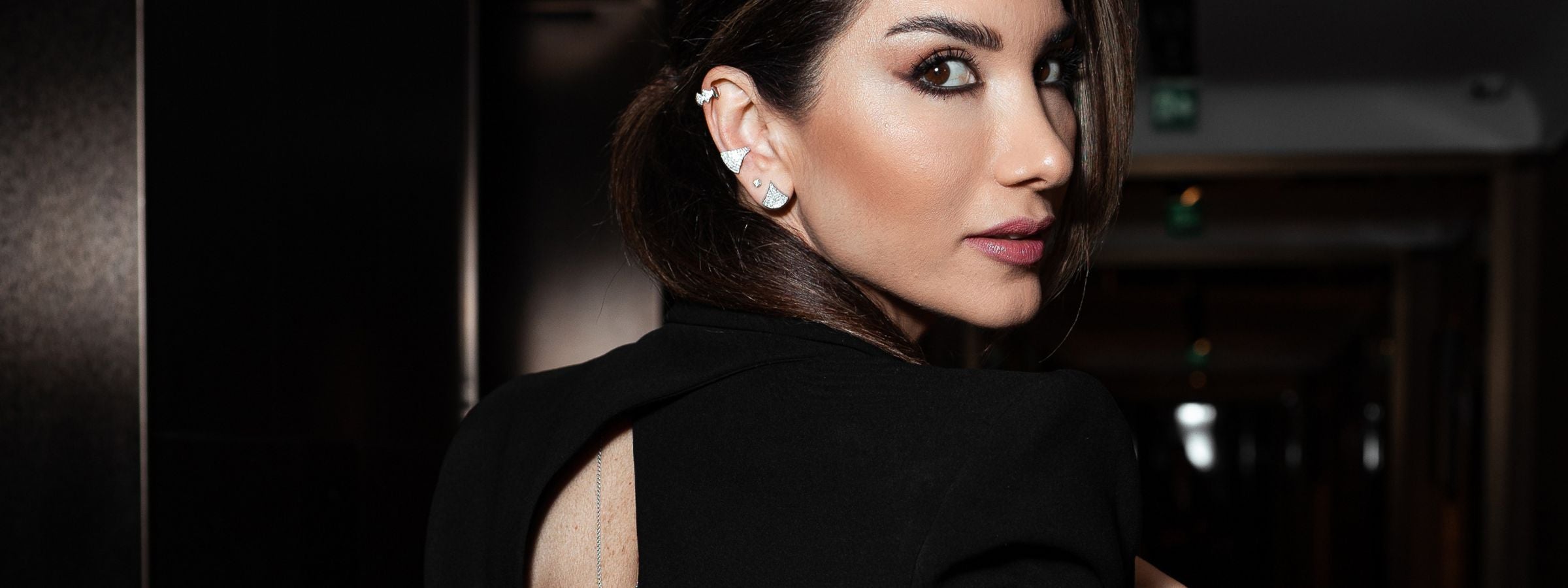 Josette Leon posing wearing handcrafted jewelry