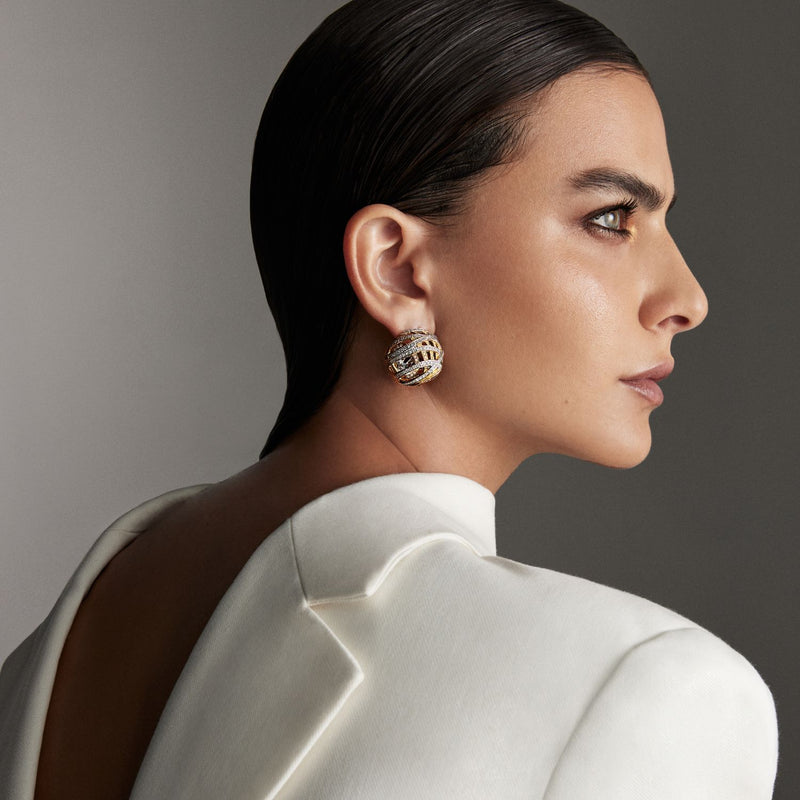 Model wearing Aura Earrings-high jewelry in white and yellow gold with diamonds